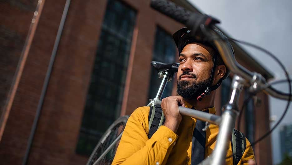 man holding bike