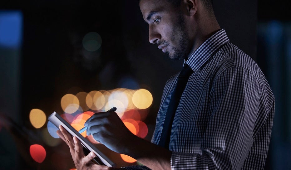 Man looking at phone before crossing the street Man looking at phone before crossing the street