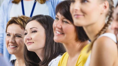 four women smiling four women smiling