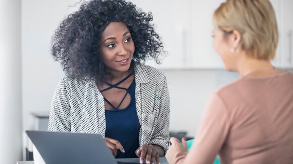 2 women discussing the option of leaving a Big 4 2 women discussing the option of leaving a Big 4
