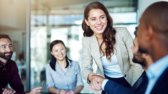 woman shaking hands with man woman shaking hands with man