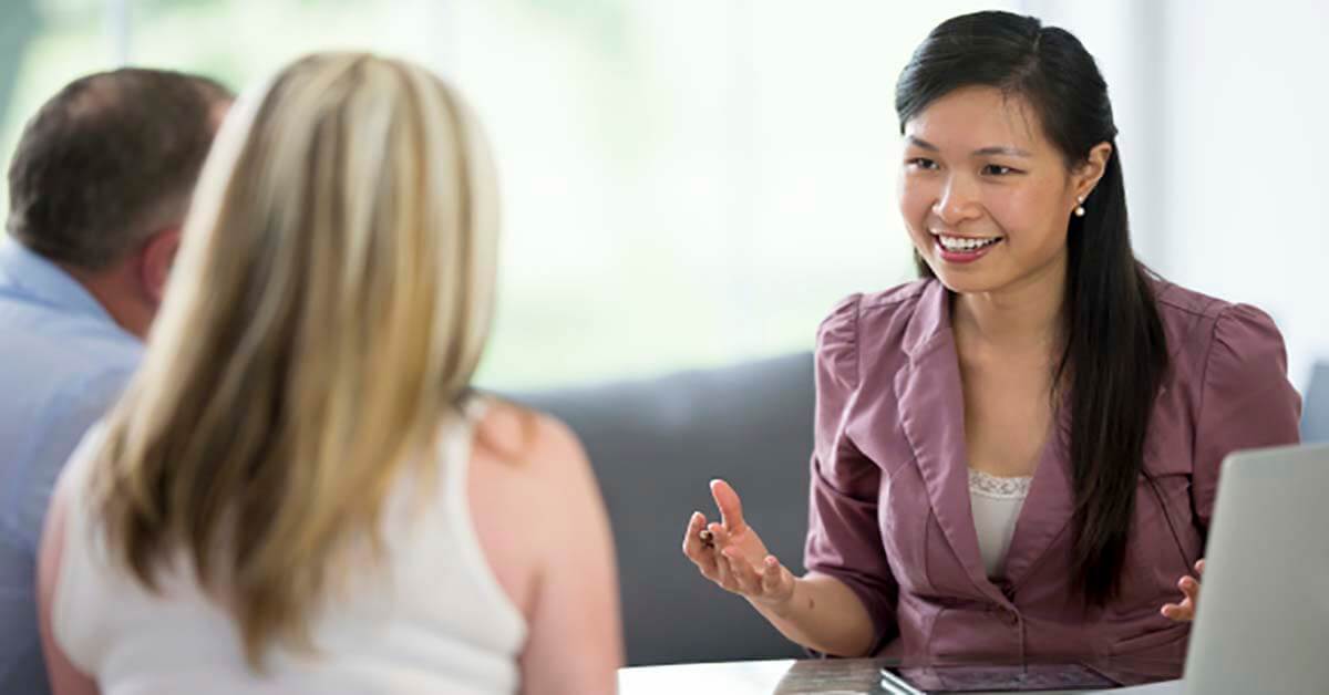 Female businesswoman on a phone call Female businesswoman excused from a meeting to take a phone call