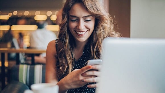 woman smiling on phone