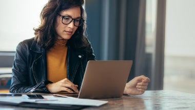 woman on computer smiling woman on computer smiling