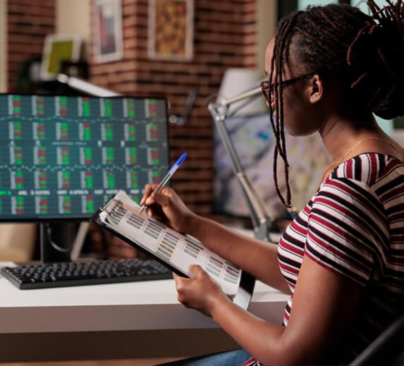 women taking notes on screen