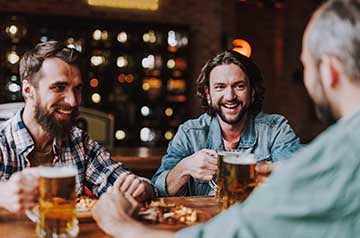 Guys having a beer