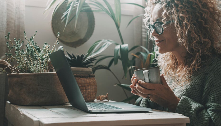 Woman with laptop and coffee