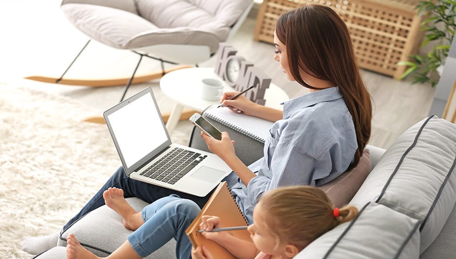 woman and girl on couch